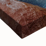 Close-up of a vibrant landscape canvas print depicting dramatic canyons at sunset, showcasing rich colors and intricate textures, ideal for home decor.