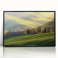 Framed acrylic artwork showcasing a serene countryside landscape, featuring lush green fields and a vibrant blue sky, elegantly displayed in a sleek black frame.