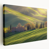 Stretched canvas artwork depicting a serene countryside landscape with rolling hills and a vibrant sky, perfect for home decor and nature enthusiasts.