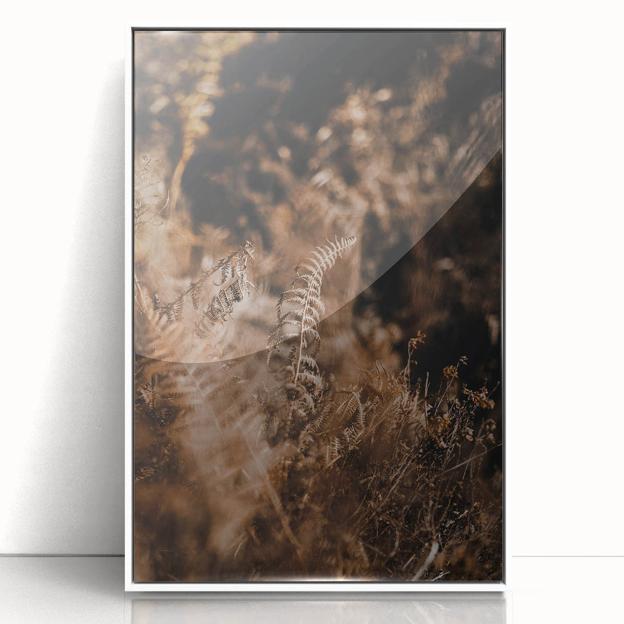 Art deco poster featuring autumnal trees in muted orange and brown tones, framed in white acrylic.