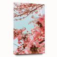 Large abstract wall art on acrylic glass depicting spring themes in soft green and pink tones.