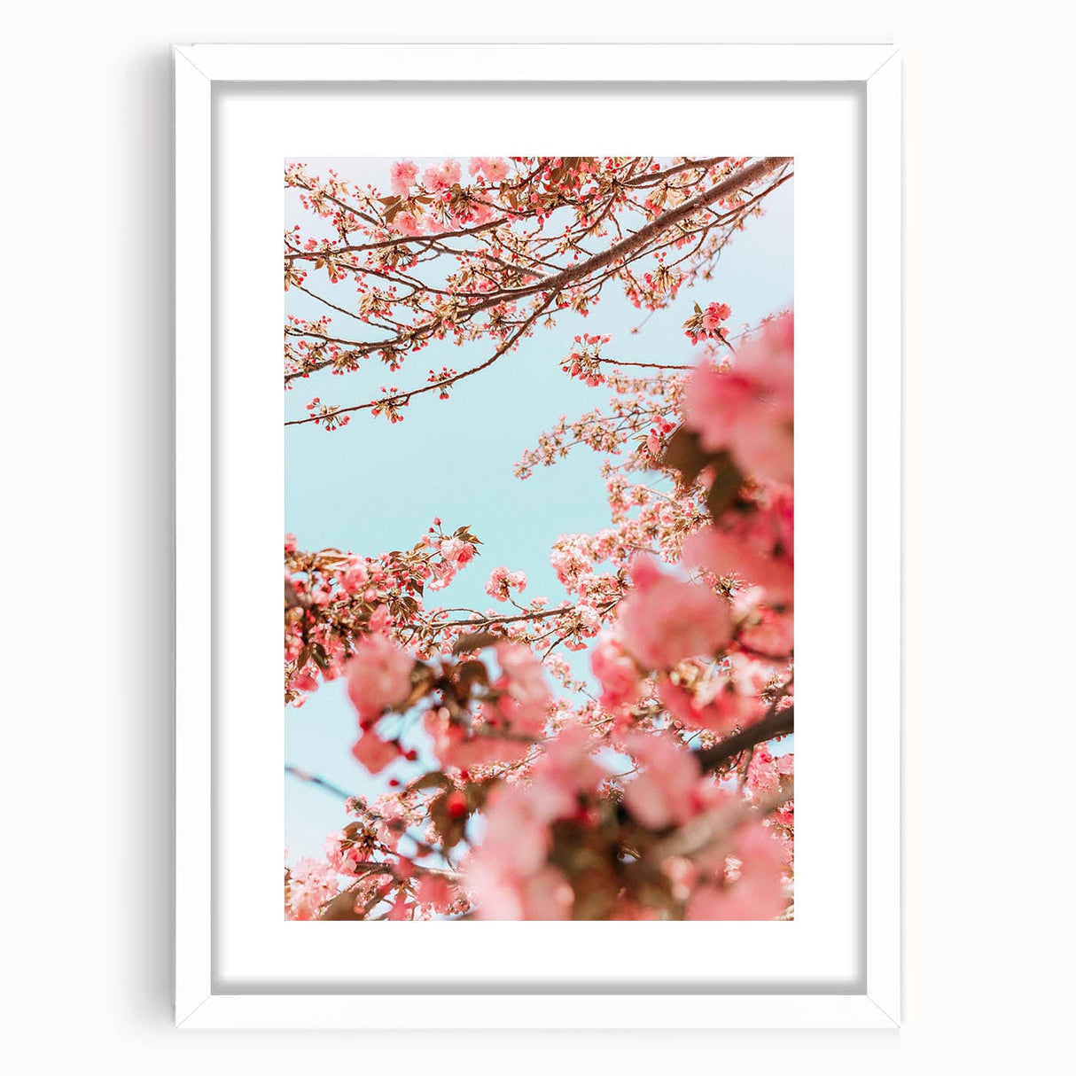 Abstract art print in soft pastel colors on a white framed canvas, suitable for bedroom or dining room decor.
