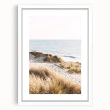 Abstract art print in vibrant summer hues on a white framed canvas, ideal for bedroom or dining room decor.