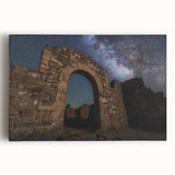 Stretched canvas artwork depicting a serene landscape with a majestic castle, surrounded by lush greenery and a clear blue sky, perfect for home decor.