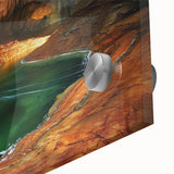 Close-up of an intricate acrylic glass artwork showcasing vibrant landscapes and caves, highlighting rich colors and fine details, perfect for home decor.