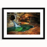 Framed landscape artwork showcasing a cave scene, presented in a sleek black frame with a mat, ideal for enhancing home décor and creating a serene ambiance.