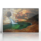 Framed acrylic artwork depicting a stunning cave landscape with intricate details and vibrant colors, set in a sleek white frame, ideal for modern decor.