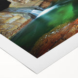 Rolled canvas print depicting a serene landscape with caves and natural formations, showcasing earthy tones and intricate details, ideal for home decor.