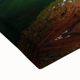 Close-up of a stretched canvas depicting a vibrant landscape with intricate cave formations, showcasing rich colors and detailed textures, ideal for home decor.