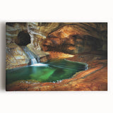 Stretched canvas artwork depicting a vibrant landscape with intricate cave formations, showcasing rich colors and textures, perfect for home decor or artistic display.
