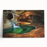 Stretched canvas artwork showcasing an abstract landscape with vibrant colors, featuring a cave scene. Ideal for modern home decor or art enthusiasts.