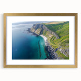 Elegant gold-framed landscape artwork featuring dramatic cliffs and serene skies, designed with a mat for added depth, perfect for enhancing home decor.