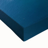 Close-up of a vibrant stretched canvas artwork depicting dramatic cliffs and lush landscapes, showcasing rich colors and intricate textures ideal for home decor.