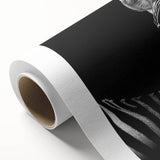 Rolled canvas artwork depicting vibrant African animal designs, showcasing intricate patterns and colors, securely packaged in a protective cardboard tube for safe delivery.
