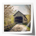Covered bridge in rustic reds and browns on a glossy photo print, suitable for art wall dining room.