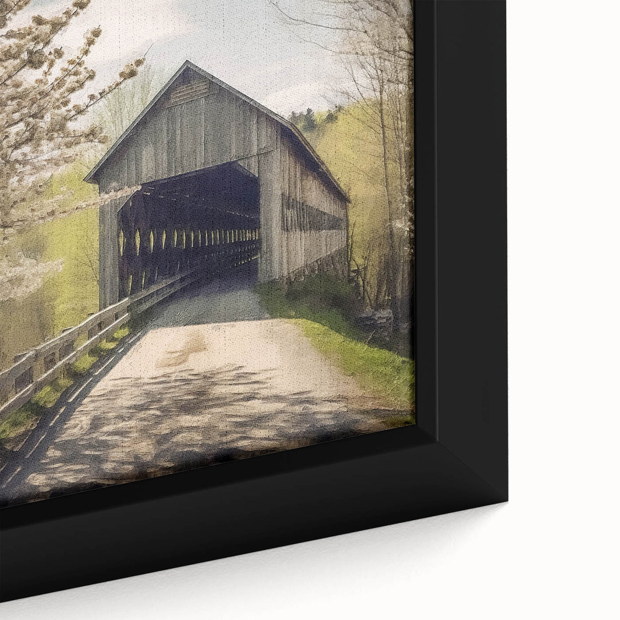 Close-up of a framed canvas featuring a black covered bridge with textured, colorful art accents.