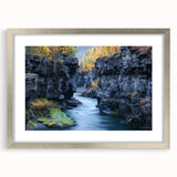 Silver-framed landscape artwork depicting a vibrant canyon scene, featuring rich colors and intricate details, suitable for home decor or art enthusiasts.