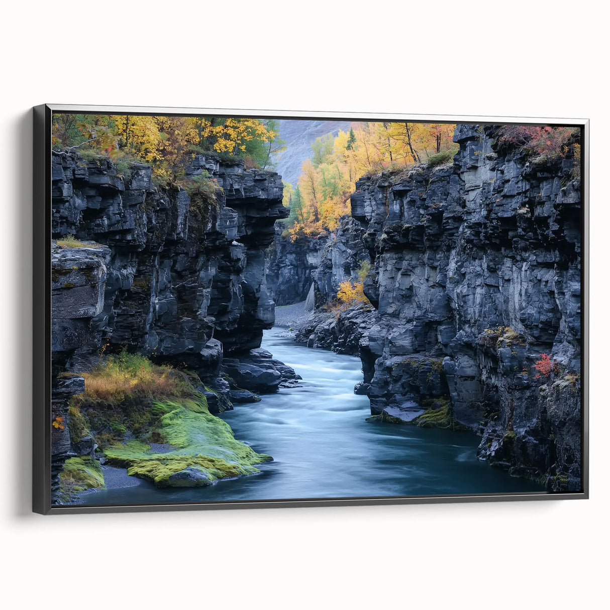 Framed landscape canvas showcasing a stunning canyon view with rich earth tones and detailed textures, set against a sleek black frame, perfect for home decor.