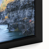 Close-up of a framed canvas print showcasing a stunning landscape of colorful canyons, highlighting intricate textures and natural details, perfect for home decor.