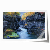 Vibrant landscape print showcasing majestic canyons in rich earthy tones, rolled and ready for display, ideal for enhancing home decor with natural beauty.