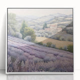 Framed landscape wall art depicting a serene countryside scene, featuring lush green fields and a clear blue sky, showcased in a sleek white frame for modern decor.