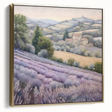 Framed landscape wall art depicting a serene countryside scene with vibrant green fields and a soft blue sky, accented with silver and gold tones for a chic look.