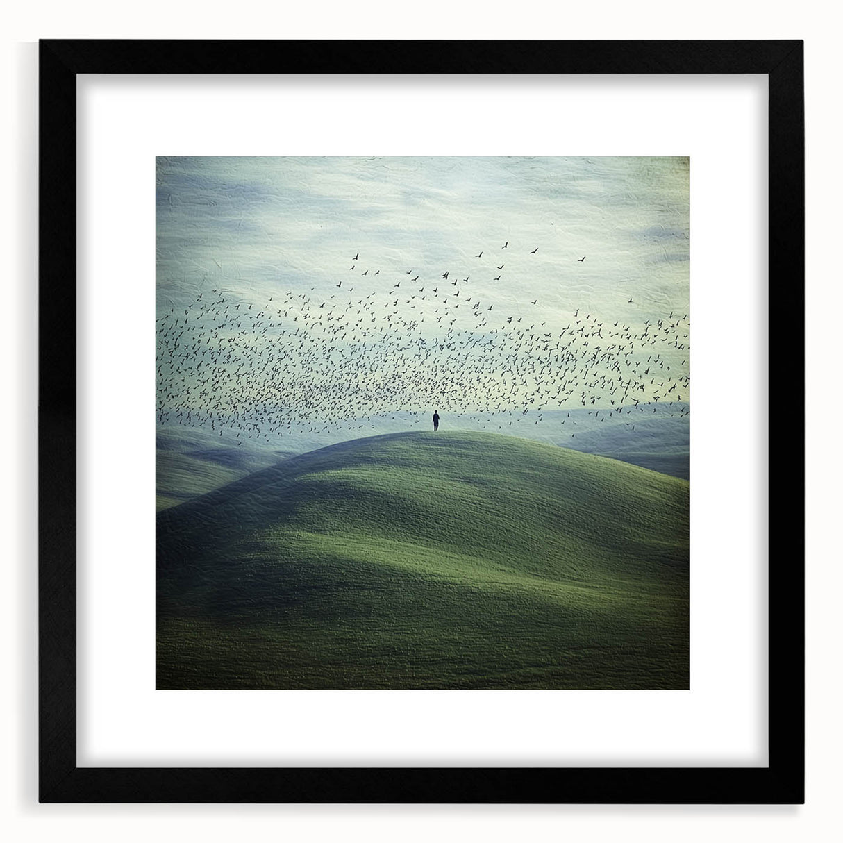 Black-framed landscape artwork featuring serene countryside scenery, presented with a white mat for an elegant finish, ideal for home decor.