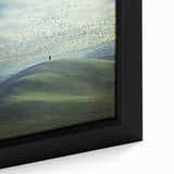 Close-up of a framed canvas showcasing a serene countryside landscape, featuring lush green fields and vibrant blue skies, ideal for home decor enhancement. The artwork captures the tranquility of rural life, making it a perfect addition to any living space or office.