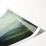 Rolled print showcasing a serene countryside landscape with rolling hills and vibrant greenery, packaged securely in a protective cardboard tube for safe delivery.