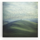 Vibrant stretched canvas artwork depicting serene countryside landscapes, showcasing lush green fields and a tranquil sky, perfect for home decor.