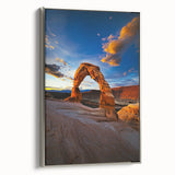 Framed canvas artwork depicting a serene desert landscape in warm tones, featuring a silver frame that enhances its modern aesthetic. Ideal for home decor.