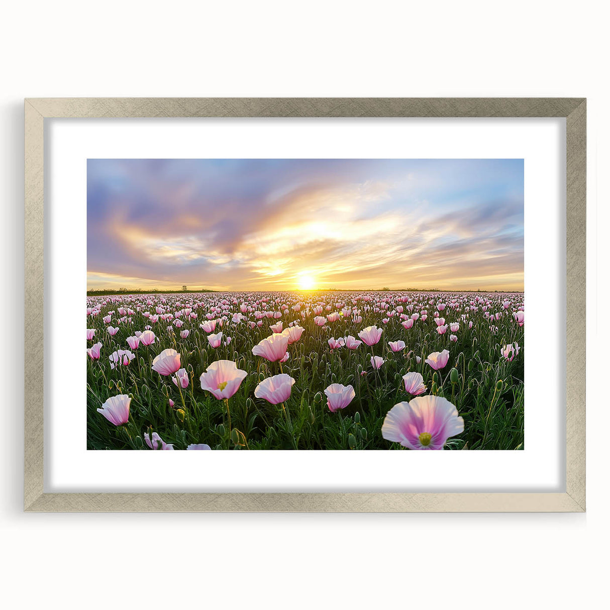 Silver-framed landscape artwork featuring vibrant green fields and a blue sky, presented with a white mat, ideal for home decor or office spaces.