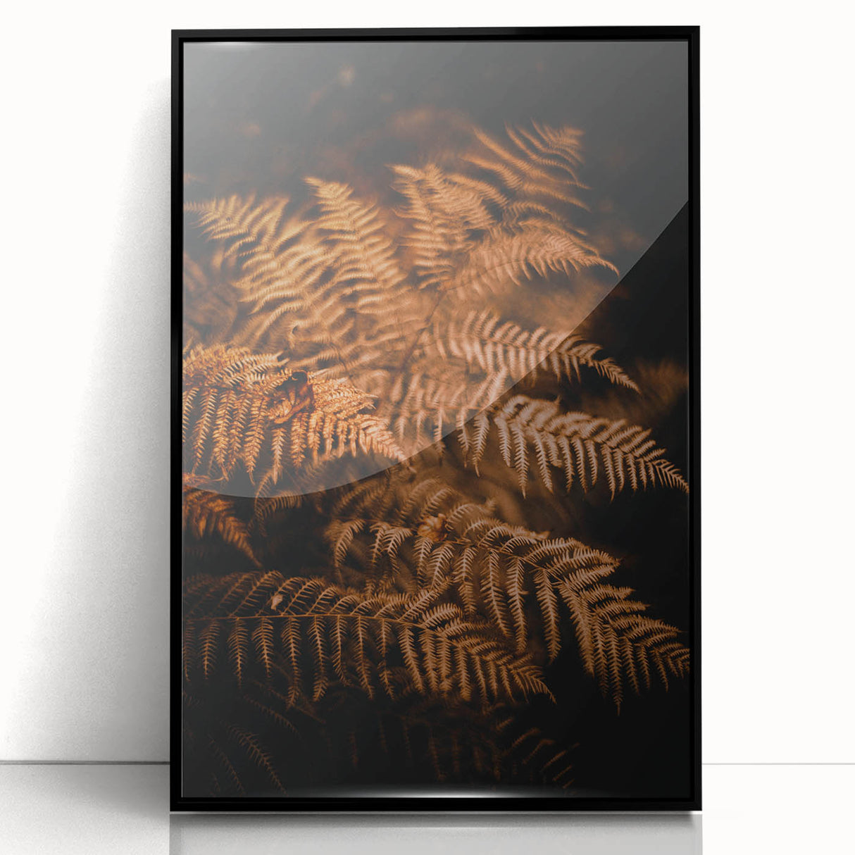 Large abstract wall art depicting fall foliage in orange and red, framed in black acrylic.