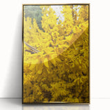 Large art print of a mid-century modernist spring scene in muted green and gold tones on framed acrylic.