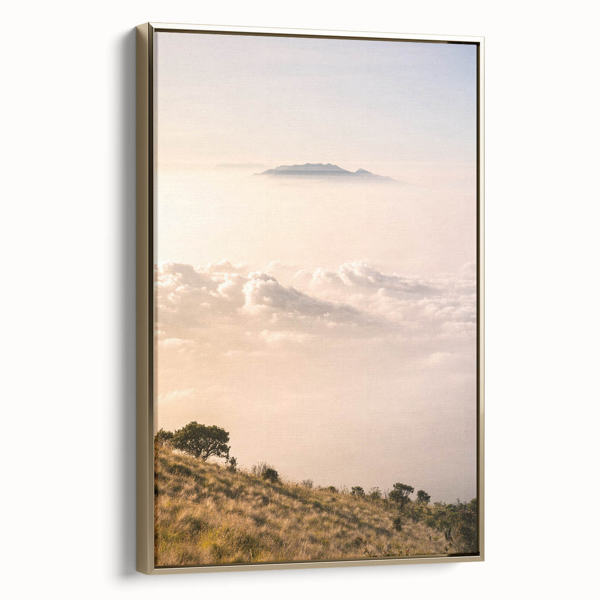 Framed canvas featuring a vintage poster-style landscape painting with lush greenery and golden hues.