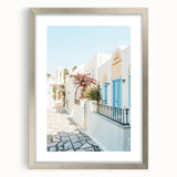 Textured abstract art print in muted blues and grays, framed in silver, ideal for modern bedroom ambiance.