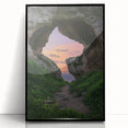 Framed acrylic artwork showcasing a stunning landscape with intricate cave details, featuring a sleek black frame, perfect for modern home decor.