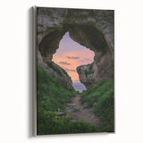 Framed canvas artwork depicting a serene landscape with caves, featuring a silver side profile. Ideal for enhancing modern home decor or office spaces.