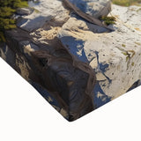 Close-up of a vibrant landscape canvas print showcasing dramatic cliffs and lush greenery, ideal for enhancing home decor with a natural aesthetic. Perfect for art enthusiasts seeking to bring the beauty of nature indoors.