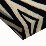 Close-up of a stretched canvas depicting vibrant animal illustrations, showcasing intricate details and colors, perfect for home decor or wildlife enthusiasts.