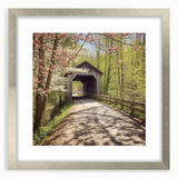 Textured art print of an abstract covered bridge in muted gray and silver tones on a framed canvas.