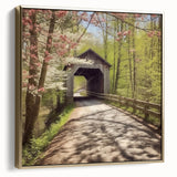 Framed canvas depicting a vintage-style landscape with a covered bridge in muted silver and gold tones.
