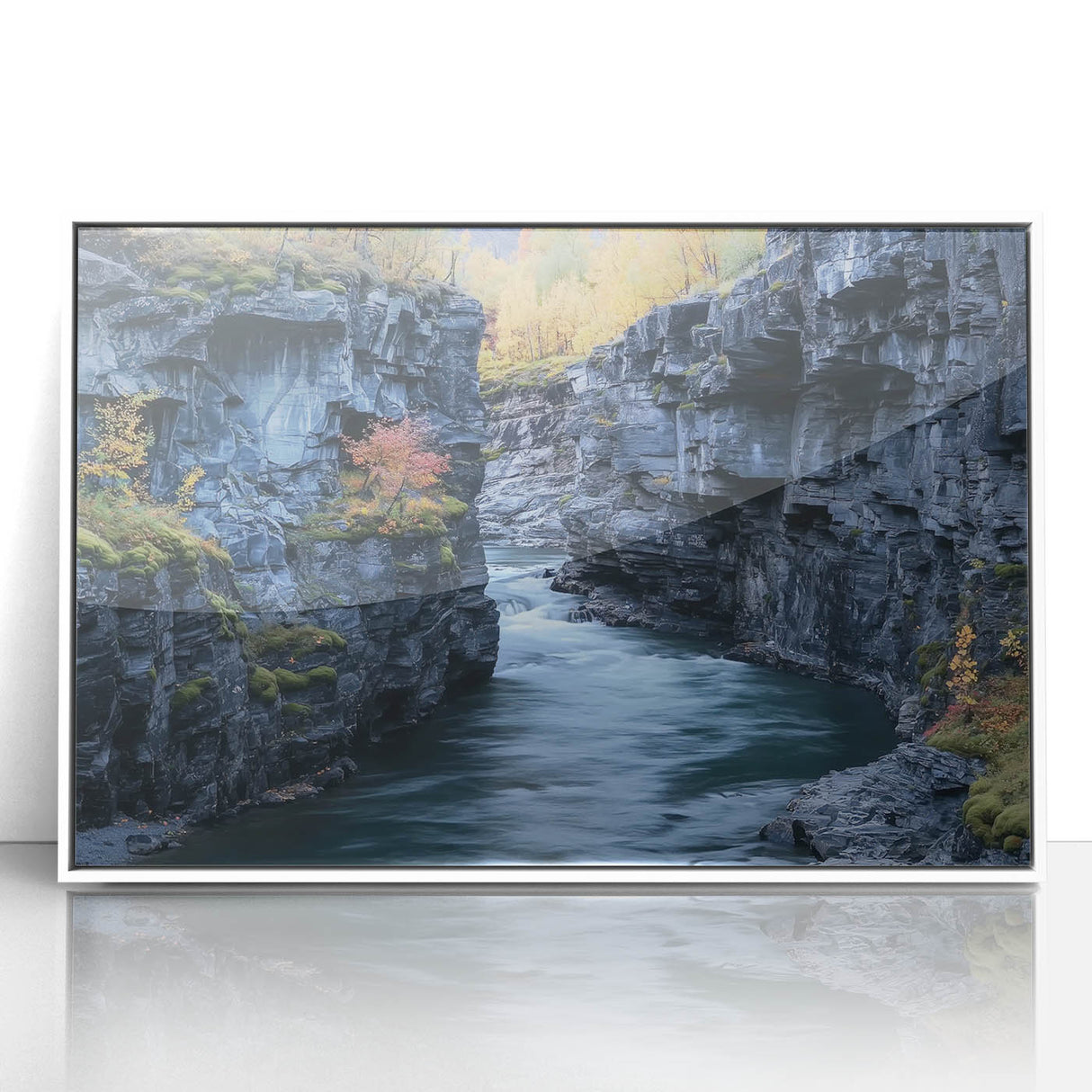Framed acrylic artwork showcasing a stunning landscape of canyons with vibrant colors, mounted in a sleek white frame, perfect for modern home decor.