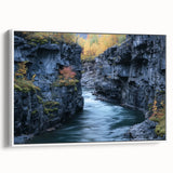 Framed canvas artwork depicting a stunning landscape of canyons, showcasing vibrant colors and intricate details, mounted in a sleek white frame for modern decor.