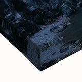 Close-up of a stretched canvas print showcasing a vibrant landscape of canyons, highlighting rich earthy tones and intricate textures, ideal for home decor.