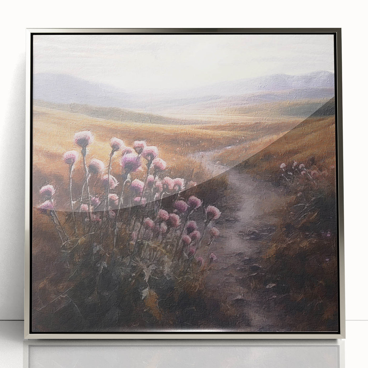 Framed acrylic wall art showcasing a serene countryside landscape with rolling hills and a vibrant blue sky, elegantly displayed in a silver frame, ideal for home decor.