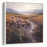 Framed landscape wall art depicting a serene countryside scene with lush greenery and a clear blue sky, showcasing a white frame that complements the artwork.