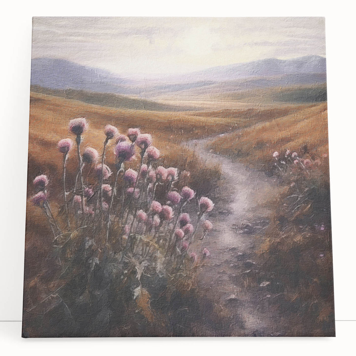 Landscape wall art featuring a serene countryside scene with rolling hills and a vibrant sunset, printed on stretched canvas and leaning against a rustic wooden backdrop. This artwork adds a tranquil touch to home decor, perfect for nature enthusiasts.