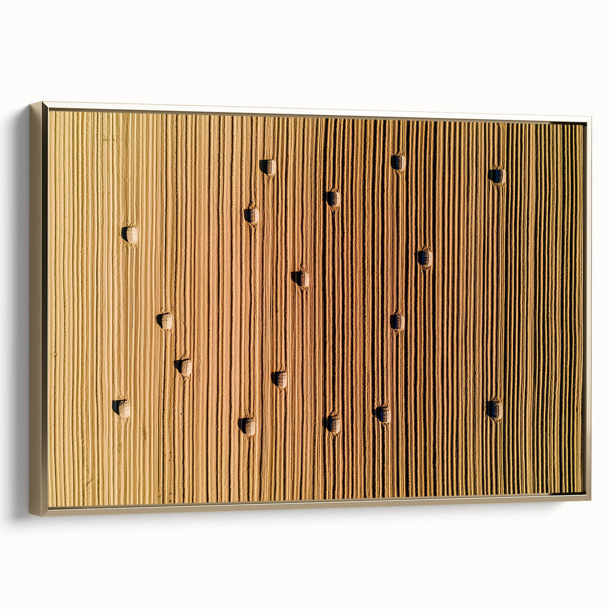 Framed canvas artwork showcasing a serene countryside landscape, featuring lush green fields and rolling hills, accented by a stylish gold frame, ideal for home decor.