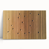 Stretched canvas artwork depicting a vibrant countryside landscape with rolling hills and a bright blue sky, leaning against a wall, showcasing rich colors and serene nature.